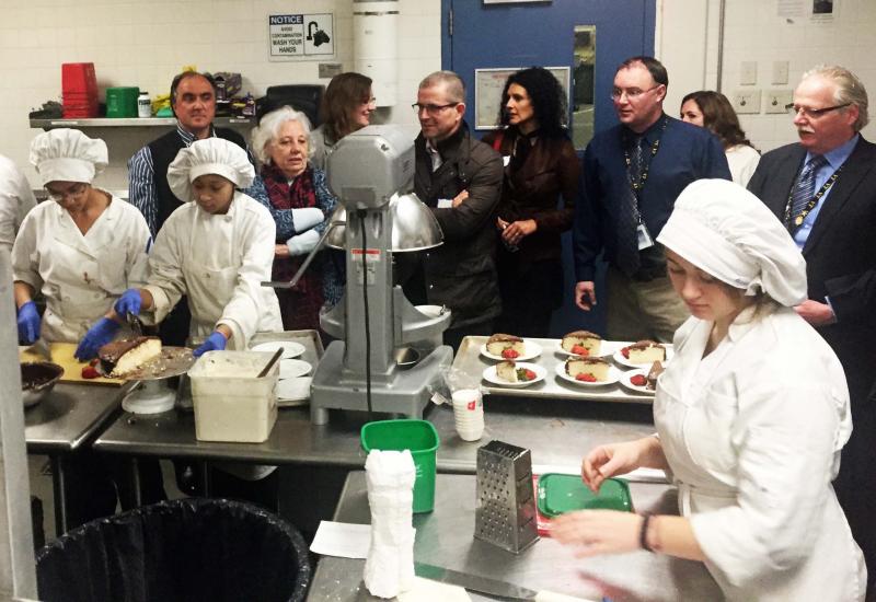 School officials and visitors from the Azores watch students prepare cakes and pastries. All 30 programs offered at GNB Voc-Tech were visited on Monday morning. BY MATTHEW BERNAT